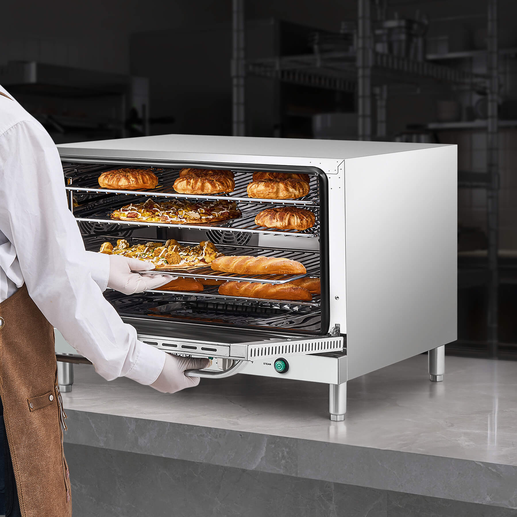 A full size countertop convection oven with visible wire racks inside, and temperature control knobs on the front.