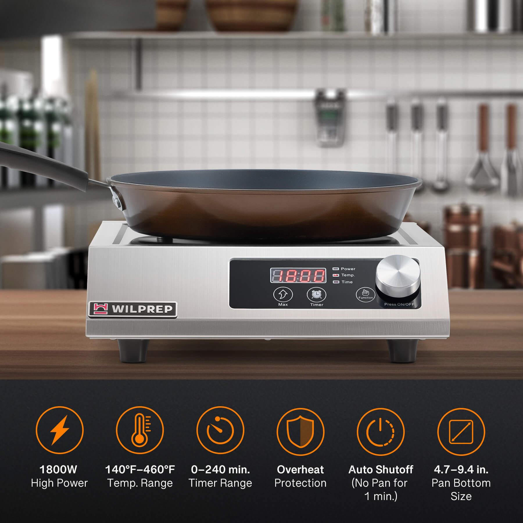 A silver-colored countertop induction cooktop with a knob control and digital display.