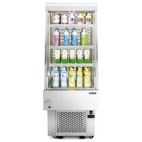 A vertical air curtain merchandiser with multiple glass doors and stainless steel frames, containing shelves with various beverages.