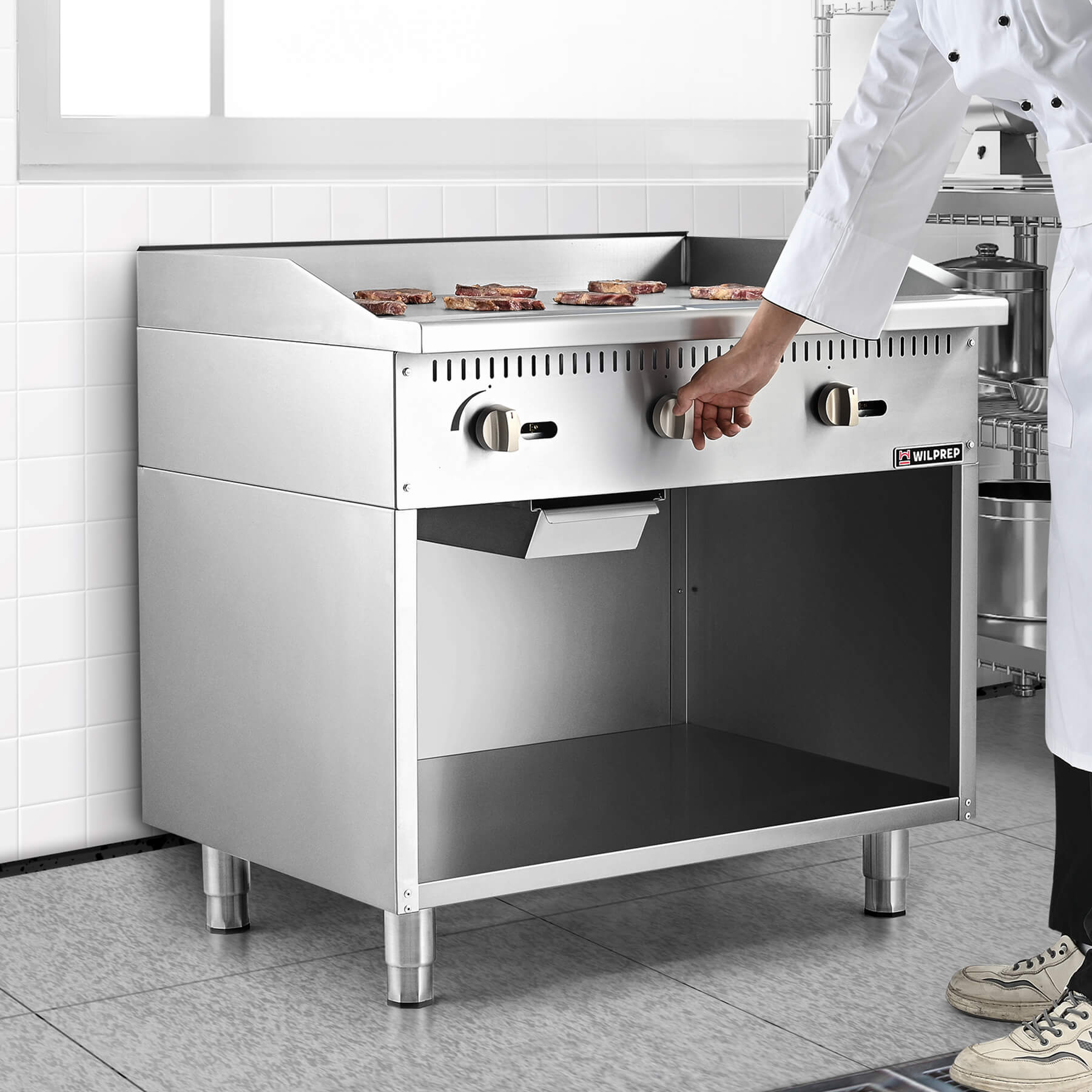 A 36 inch commercial gas griddle with cabinet base, featuring multiple knobs for control and a stainless steel finish.